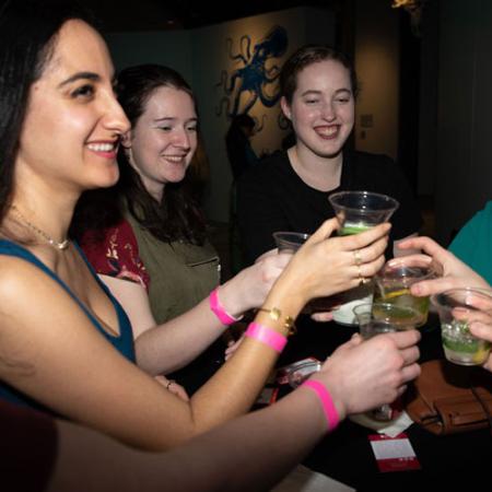 a group cheers at a night life event