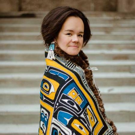 portrait of weaver lily hope wearing woven blanket