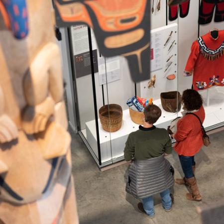 top-down view of the gallery with visitors looking at objects on display