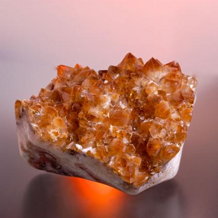 A close up view of a jagged orange citrine