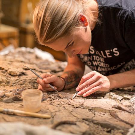 Kelsie Abrams preps a fossil